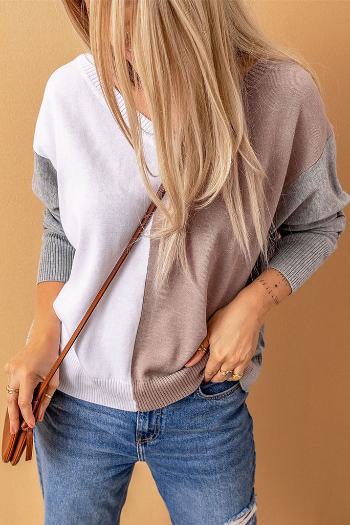 girl wearing v-neck sweater, color block, gray tan white